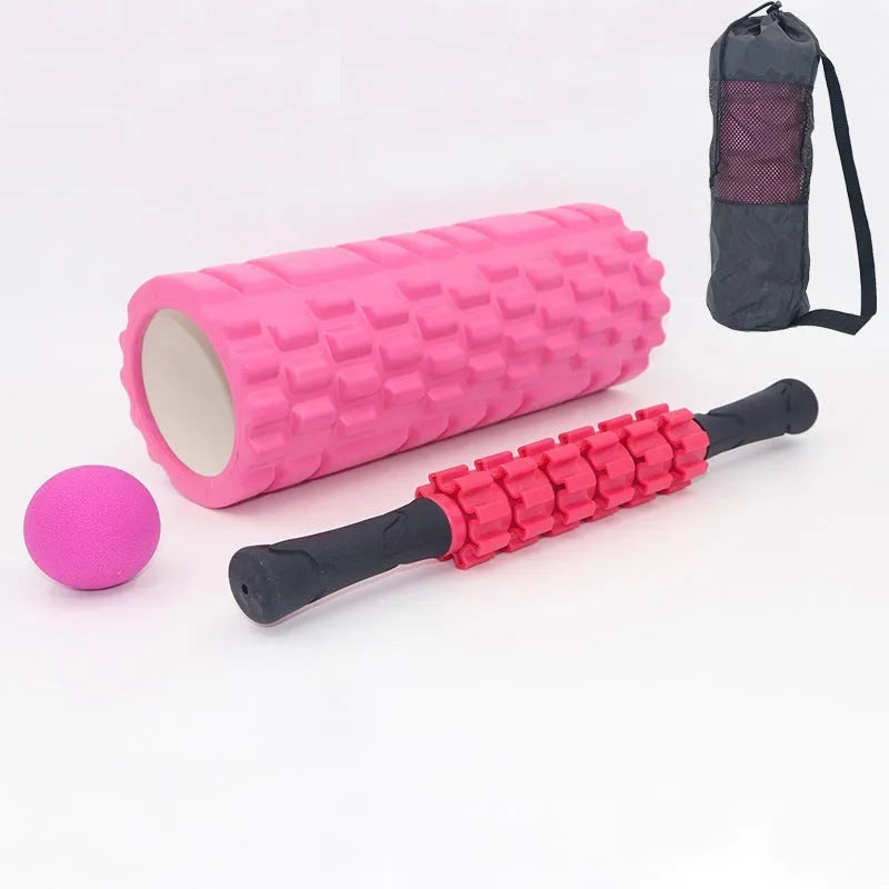 Black 33cm long foam roller massage stick with gear bar design on a grey background.