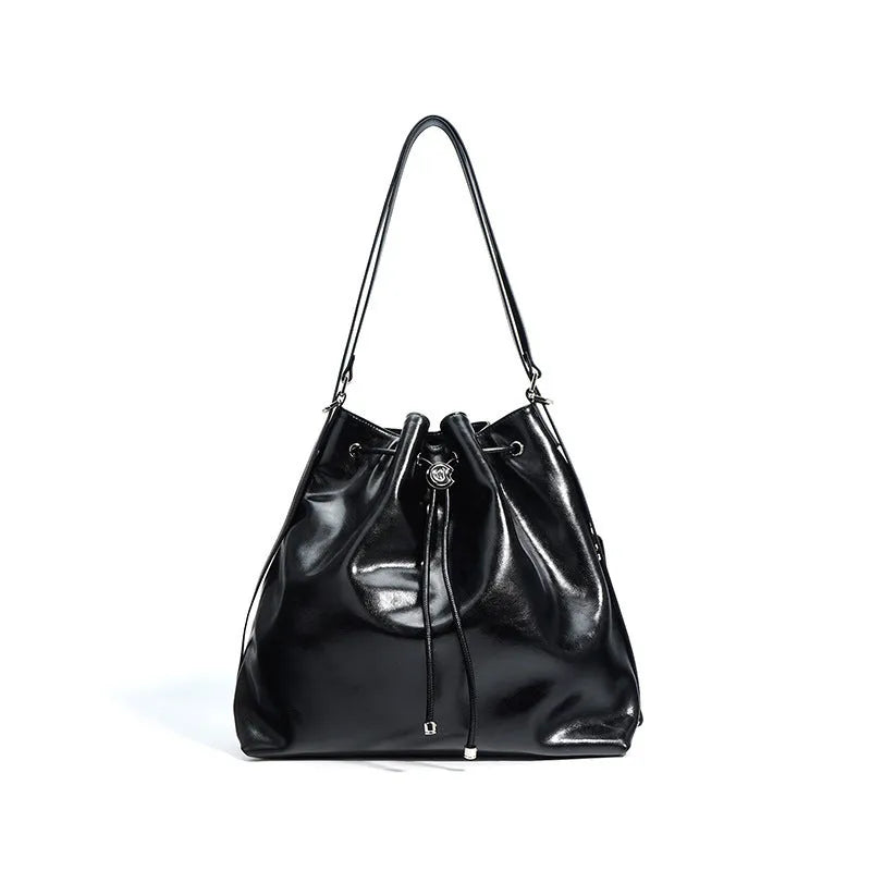 Genuine leather retro one-shoulder bucket bag in burgundy showing interior zipper and file pockets