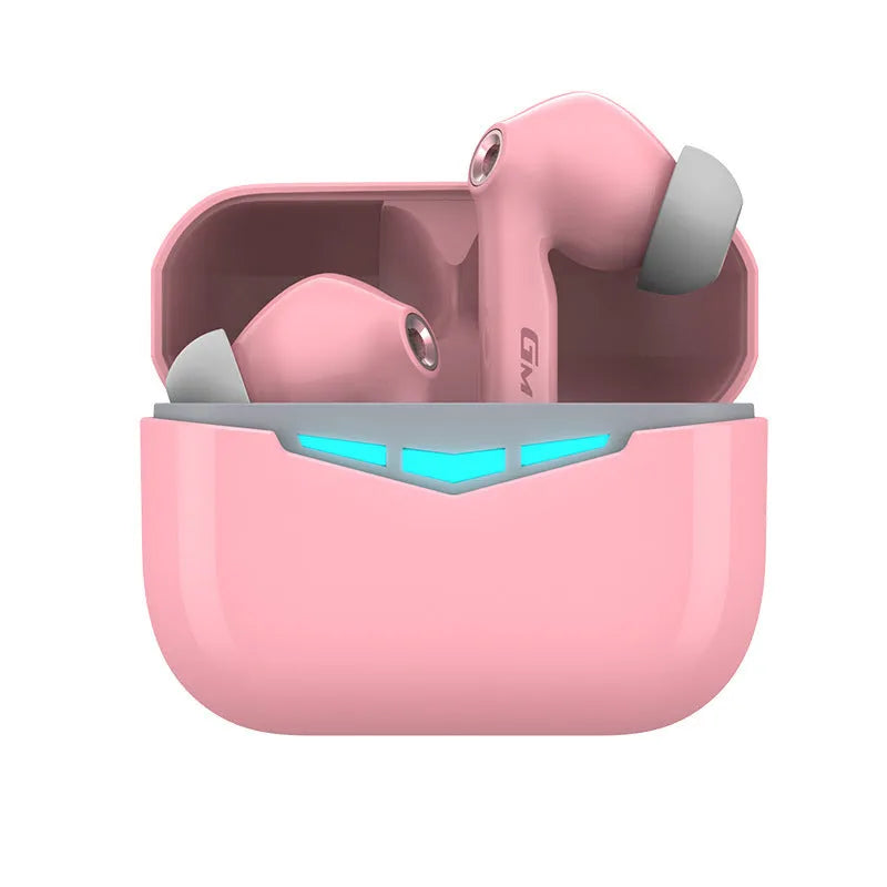 Black true wireless gaming earbuds with charging case and three pairs of silicone ear tips on a grey background.