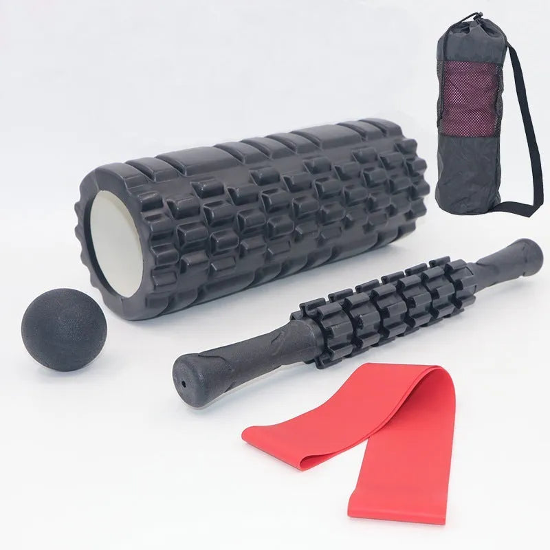 Black 33cm long foam roller massage stick with gear bar design on a grey background.