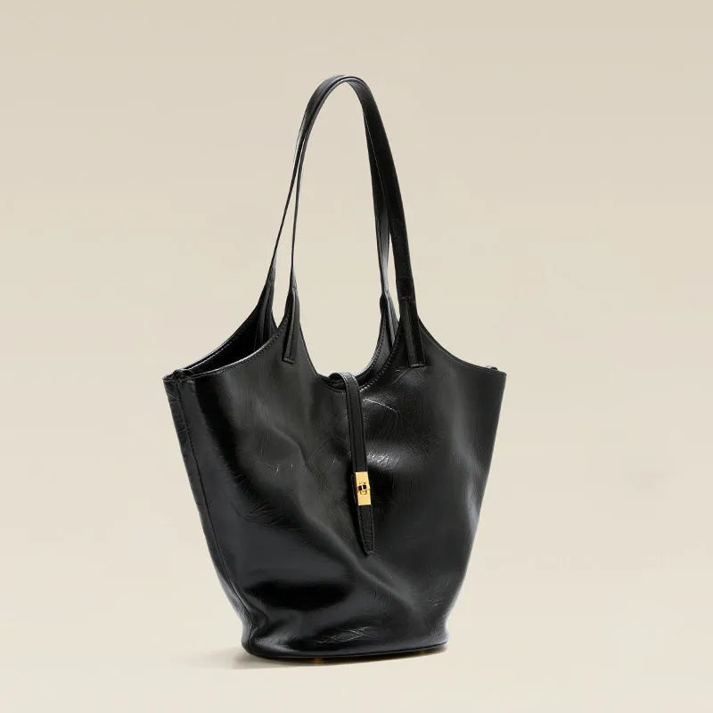 Black genuine leather large capacity bucket bag with visible stitching and crossbody strap on white background