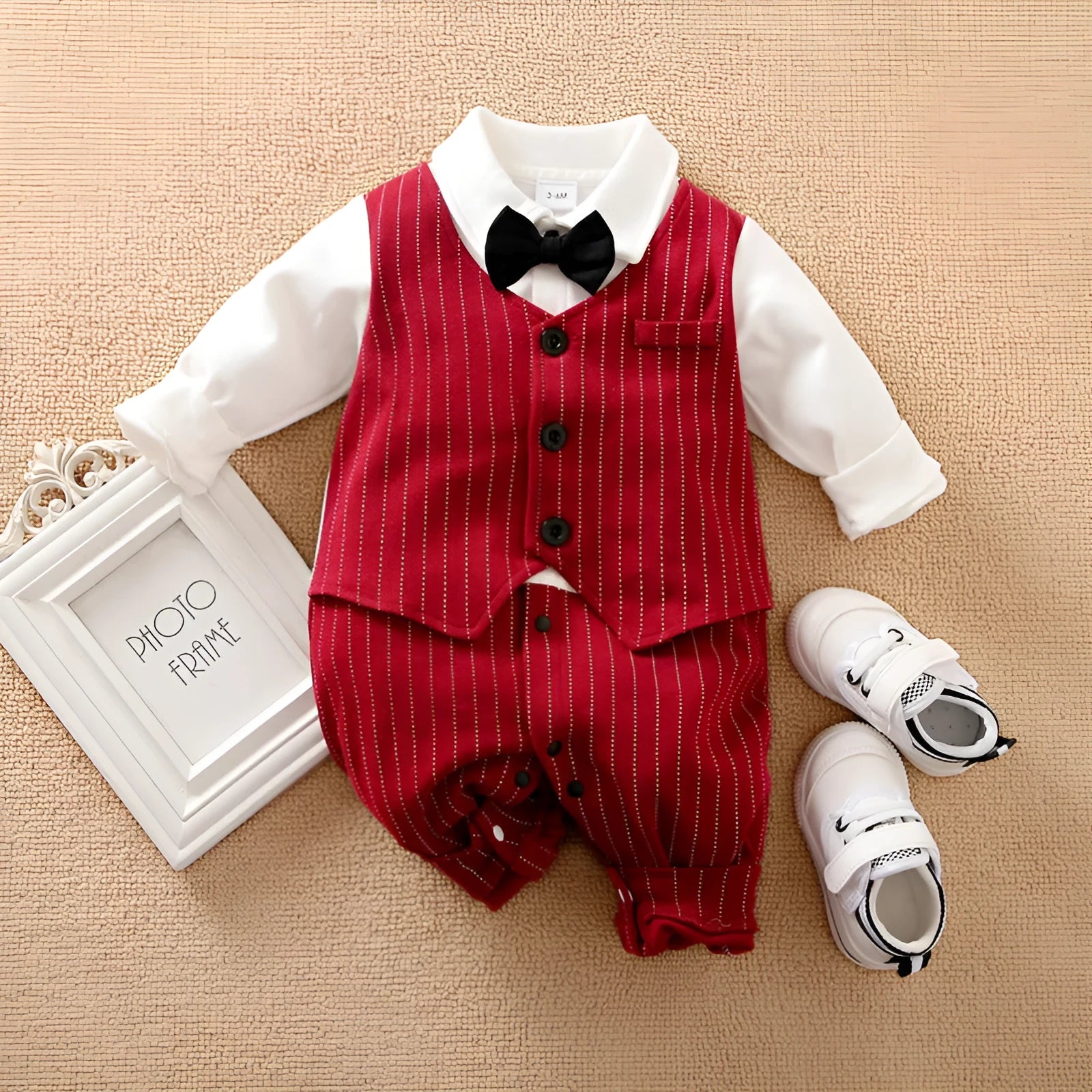 Wine red cotton baby boy's long-sleeve romper with single-breasted closure, shown laid flat.