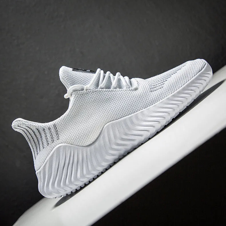 Large size men's breathable running shoes with white Hida upper and MD sole on grey background