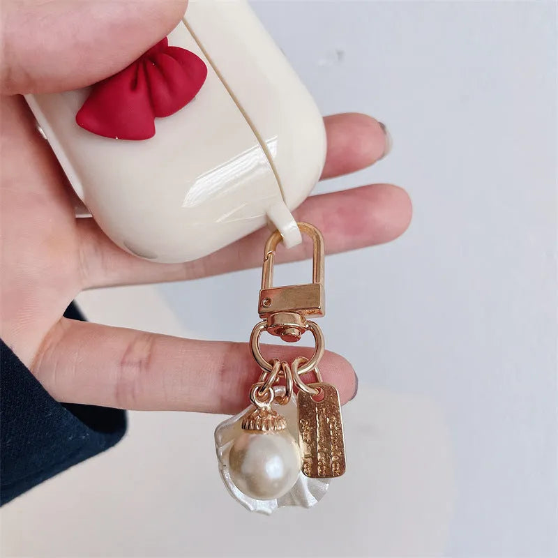 Beige TPU case with a red bow for AirPods and AirPods Pro wireless earphones
