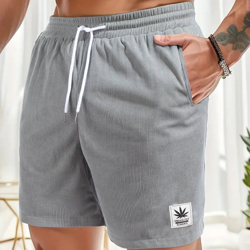 Men's grey drawstring summer shorts with elastic fabric on a mannequin