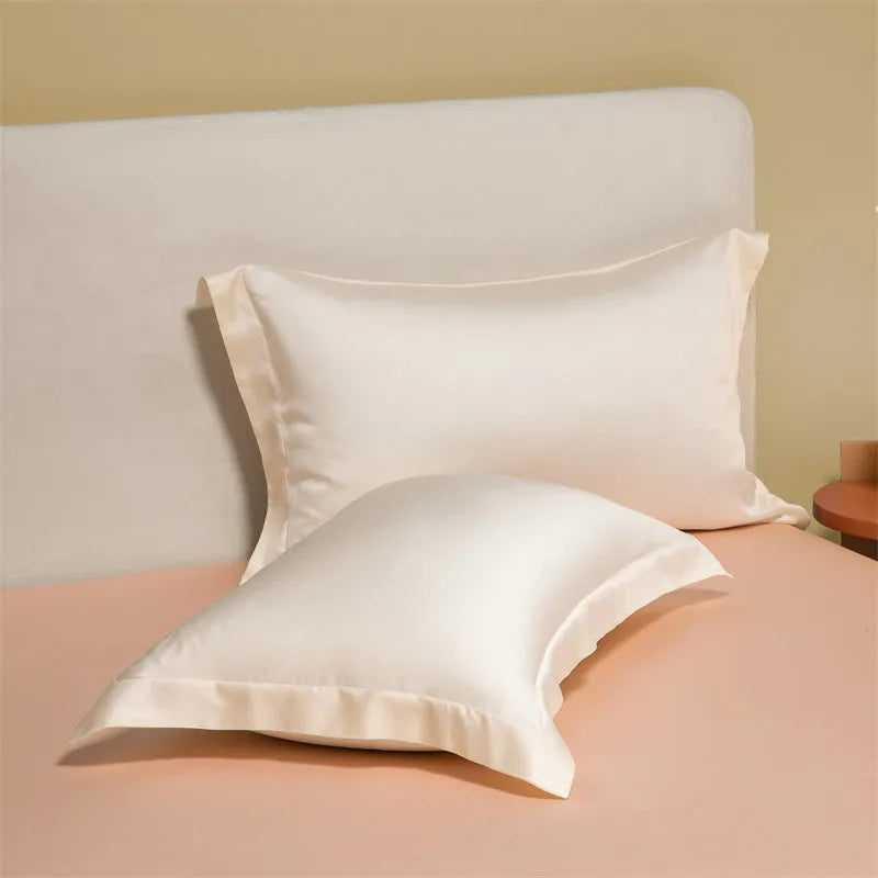 Lenzing Tencel quilt cover and pillowcase set in Aurora Blue, neatly arranged on a bed.