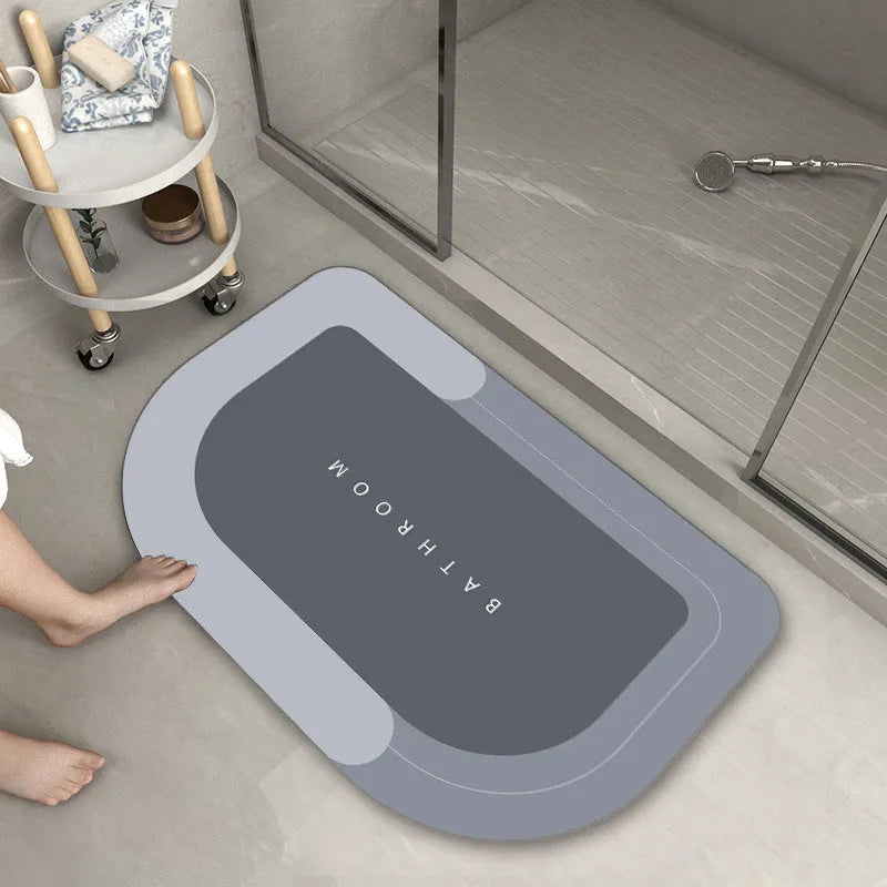 Diatom mud absorbent bathroom floor mat in blue rectangular shape on tiled floor