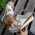 White patent leather wedge sandals with woven upper and finger fit design on a rubber sole.