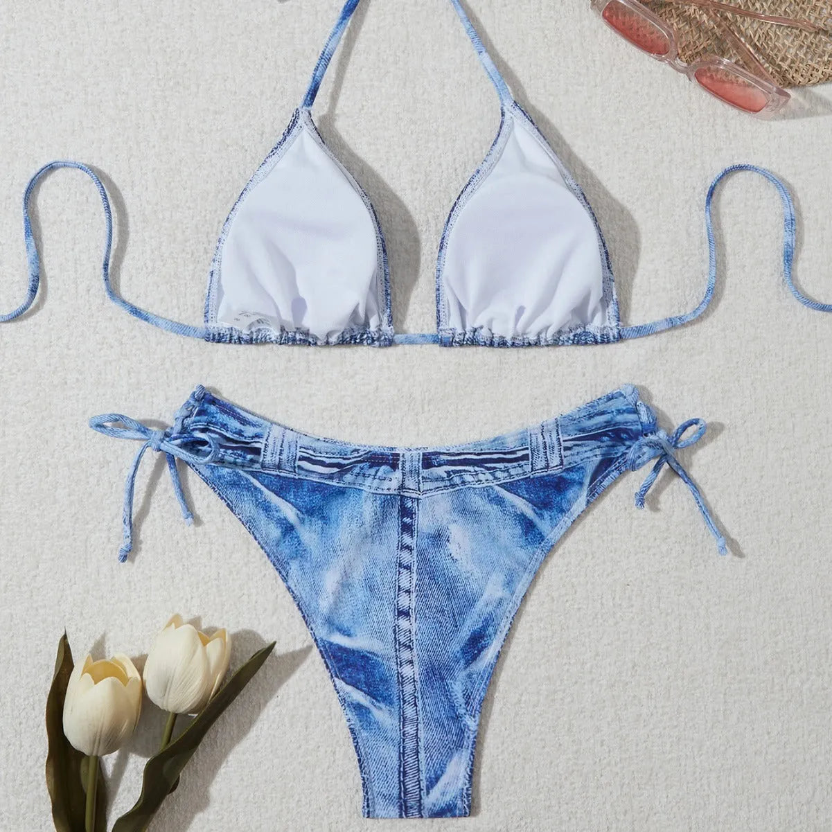 Denim blue women's bikini swimsuit with adjustable straps, shown as a complete set.