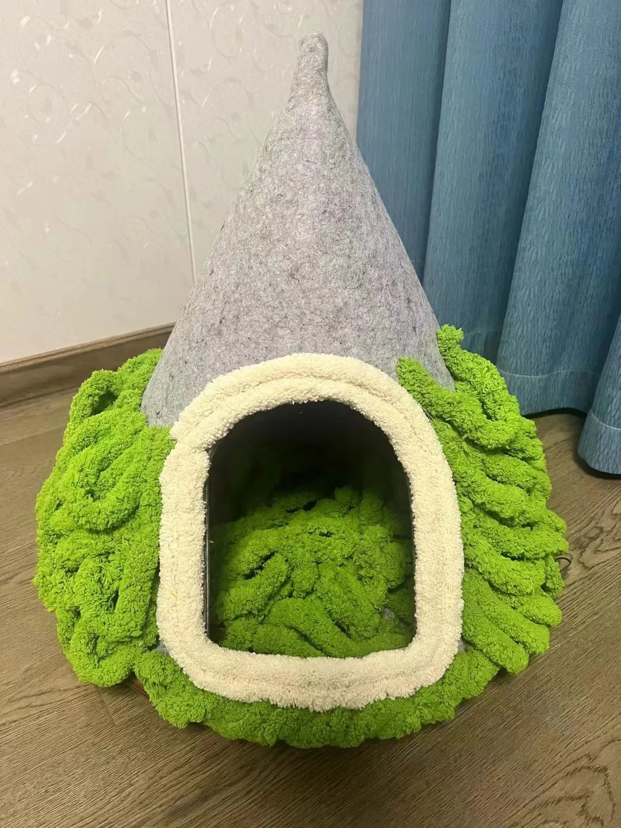 Grey handmade felt cone-shaped cat house with Christmas theme, showing enclosed tent-style design.