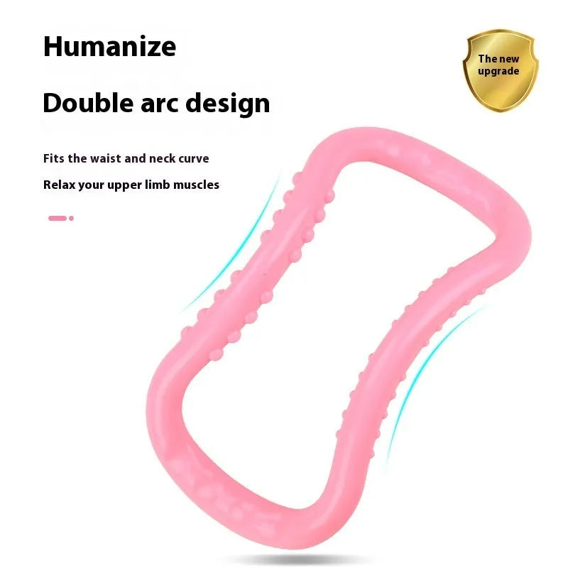 A purple PP plastic yoga ring or Pilates stretching roller on a plain background.