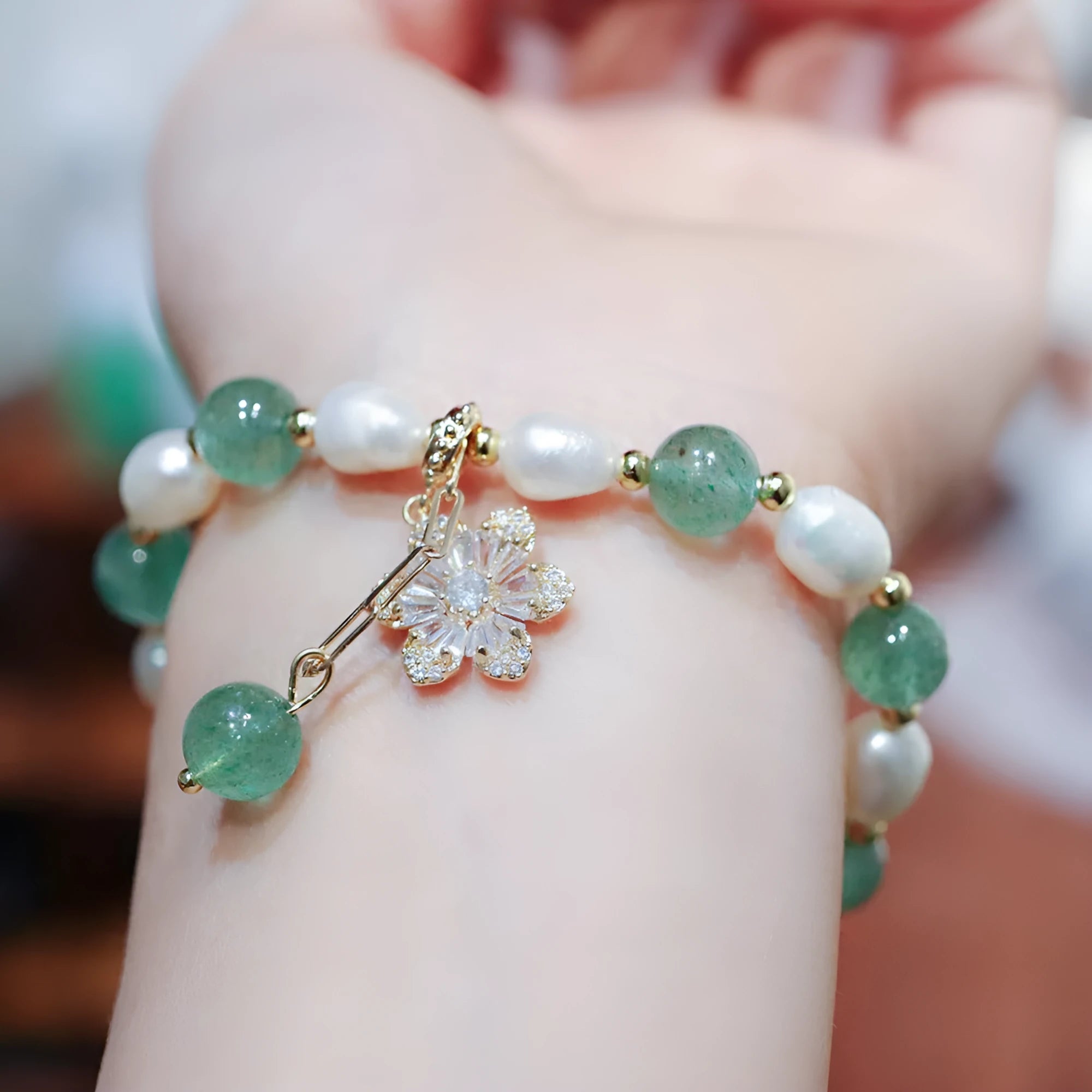 Green freshwater pearl bracelet with geometric strawberry beads and Chinese knot closure