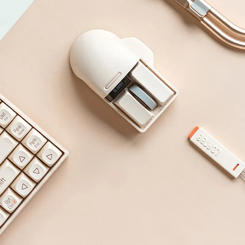 Xiaoqiao tofu-coloured wireless mouse with Type-C cable and USB receiver on a desk.