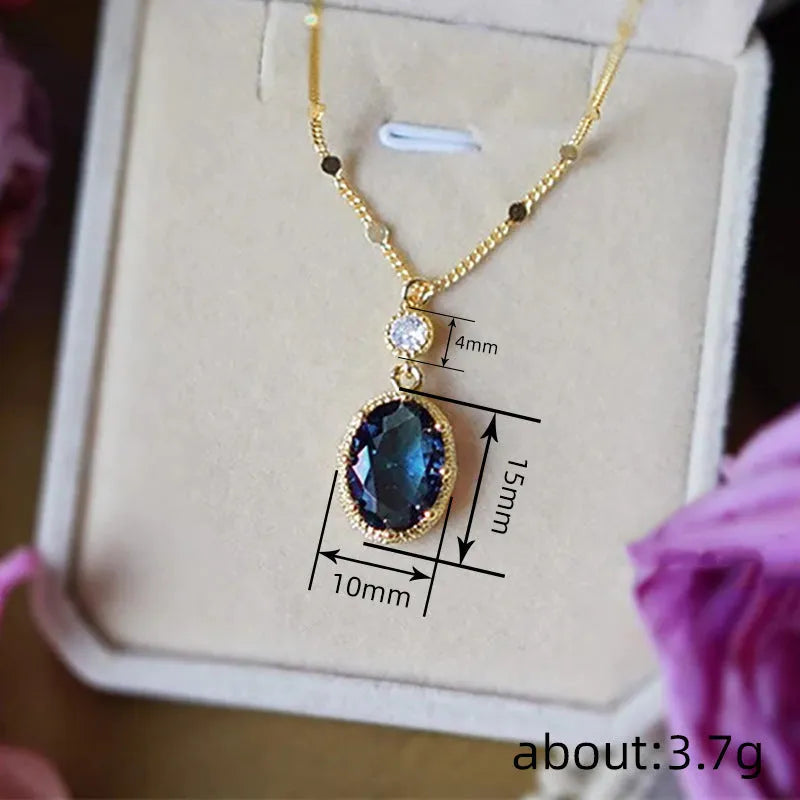 Gold geometric pendant necklace with a French retro design on a model.