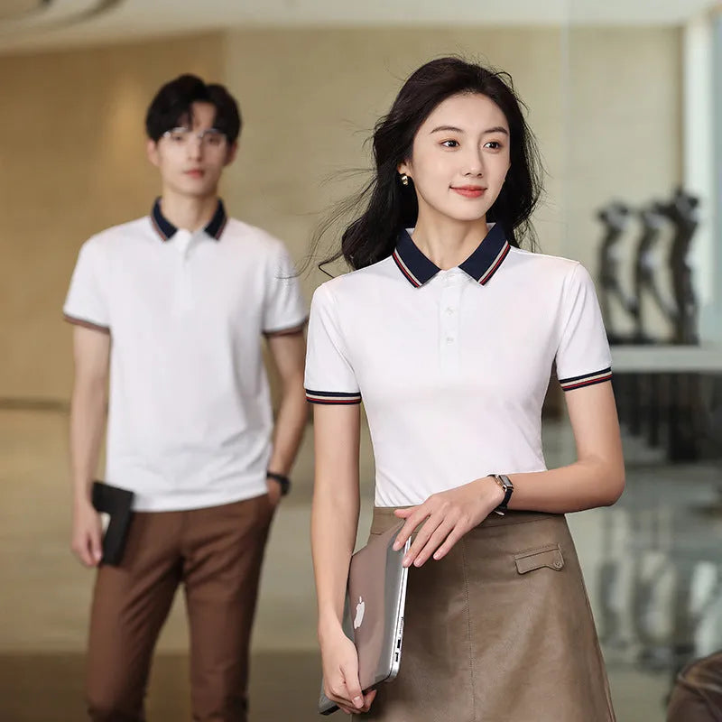 Solid colour summer polo shirt in cotton with short sleeves, loose fit, and slit detail on the side
