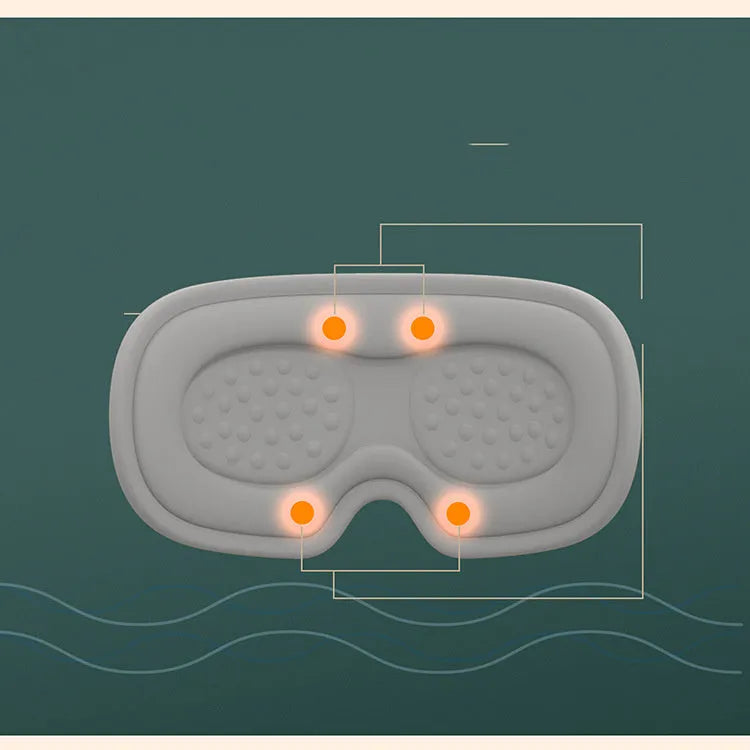 Green portable steam sleep massage goggles with suede shell on a grey background.