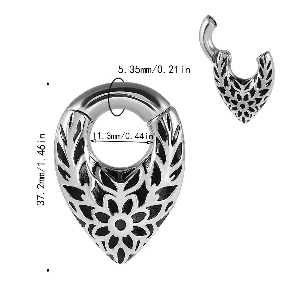 Stainless steel ear extender with egg-shaped auricle and totem design for earlobe stretching.