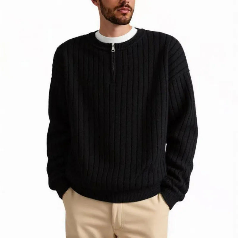 Men's grey half-zip loose knit sweater with textured fabric and long sleeves.