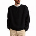 Men's grey half-zip loose knit sweater with textured fabric and long sleeves.