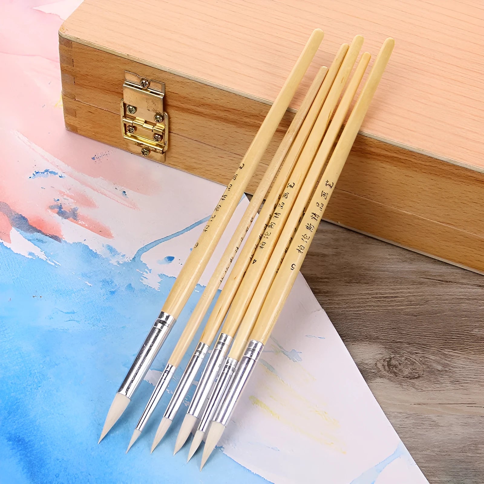Set of six wooden artistic brushes with pointed wool tips for line work and calligraphy