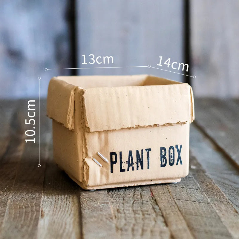 Cement flowerpot with brown paper box finish and drainage holes in bottom
