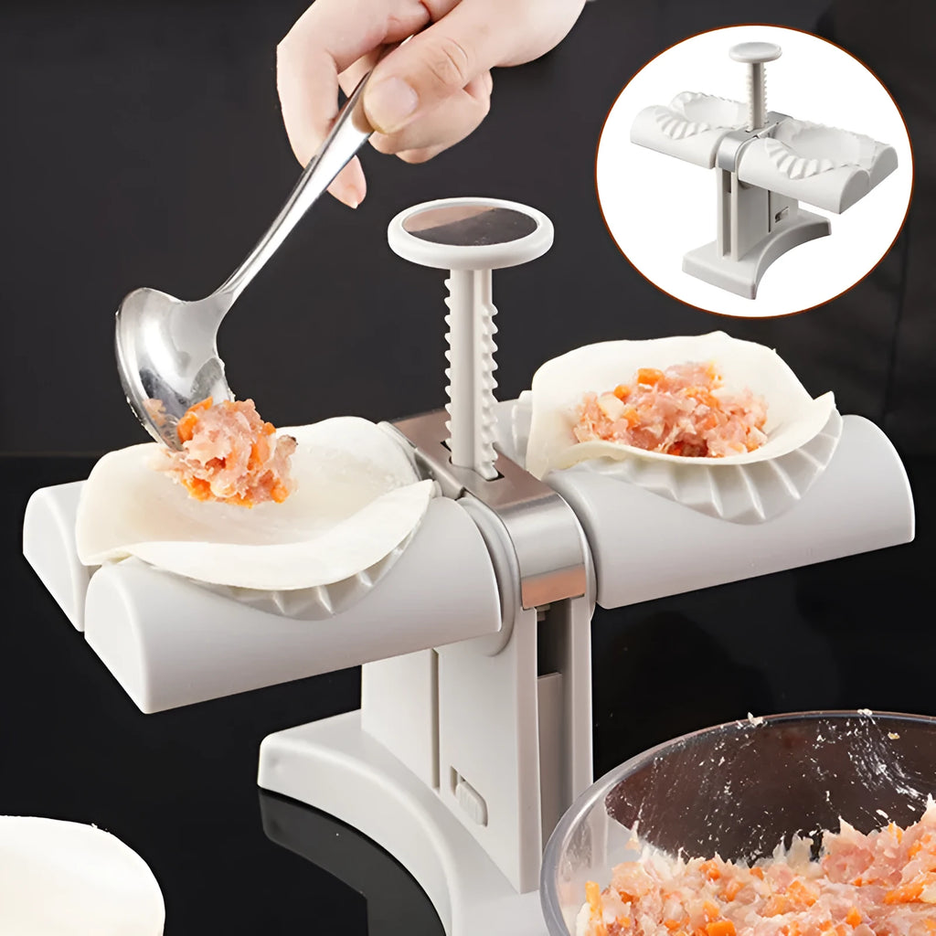 White plastic manual dumpling maker with double head press and anti-slip rubber base mat.