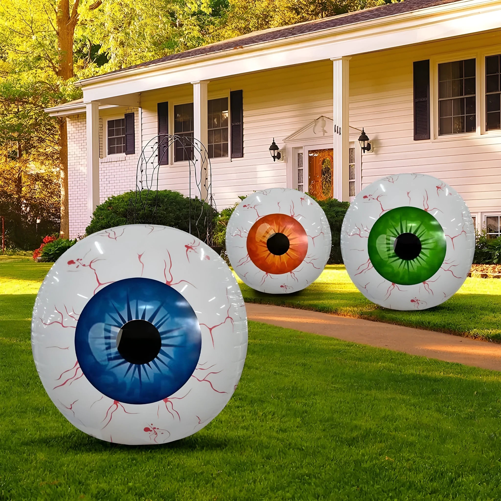 Green Halloween balloon with red bloodshot eyeball design, inflated to a round shape.