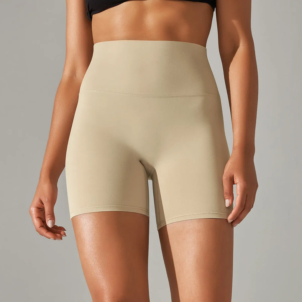 Women's high waist fitness tights in dark green, showing belly control and hip lift design for sports.