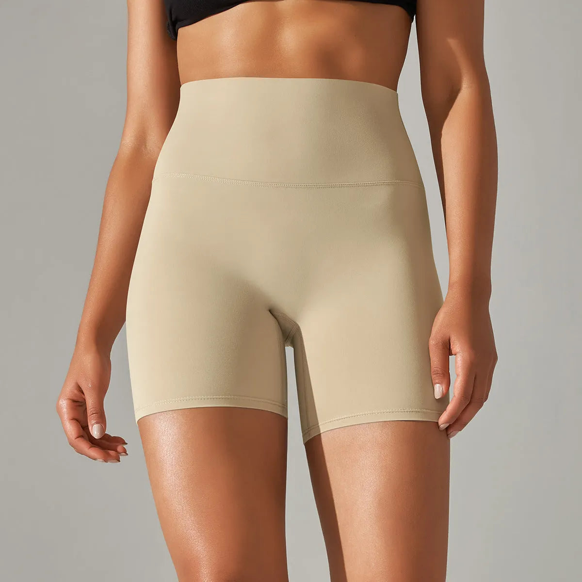 Women's high waist fitness tights in dark green, showing belly control and hip lift design for sports.