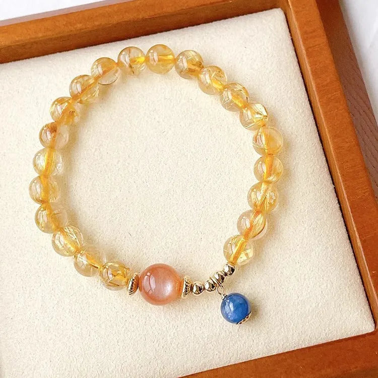 Handmade natural gold rutilated quartz and sunstone crystal bracelet with round diamond-shaped elements