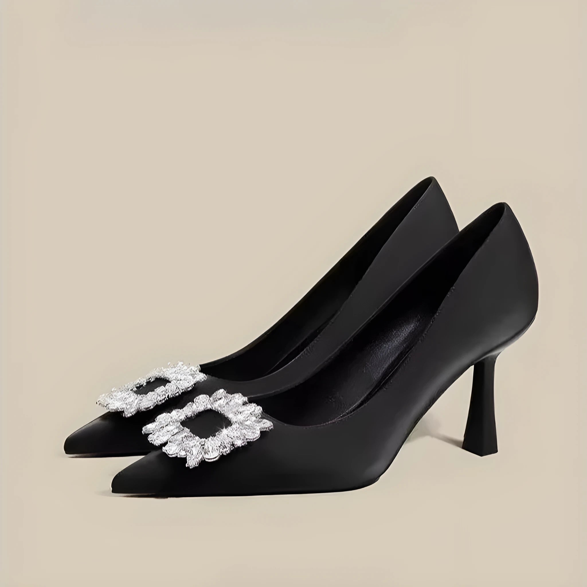 Women's creamy-white pointed toe stiletto high heel pumps for formal wear.