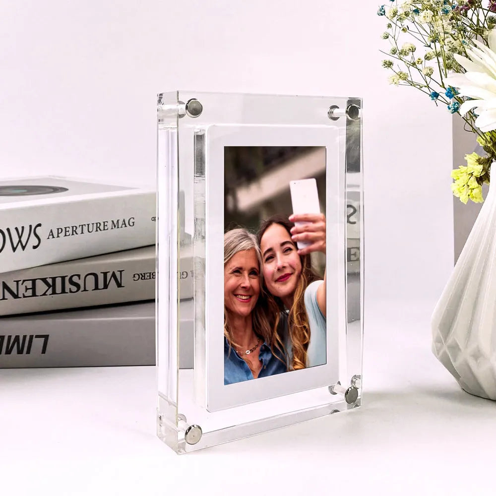 White vertical digital picture frame with 5-inch screen showing family photos