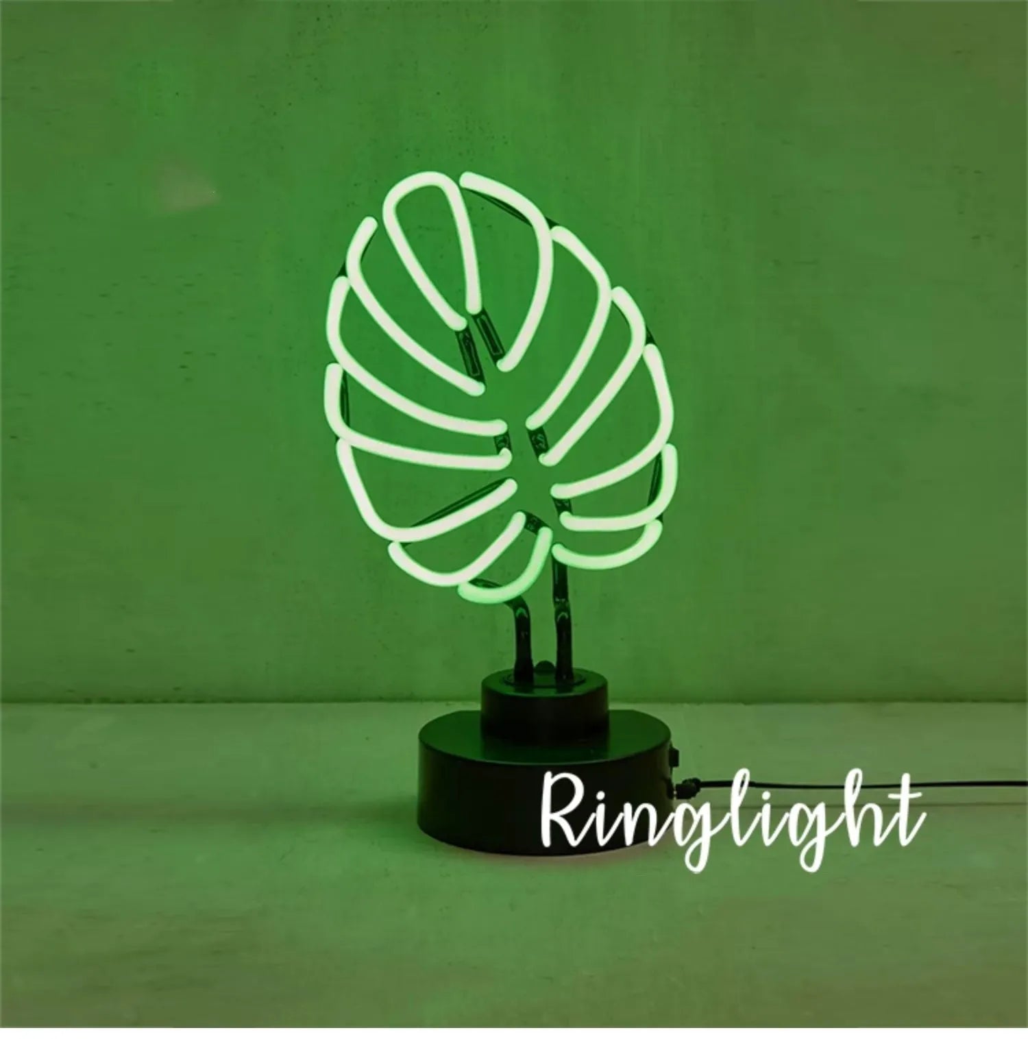 Minimalist white bamboo-shaped desktop lamp with a green glow, shown in two size options.