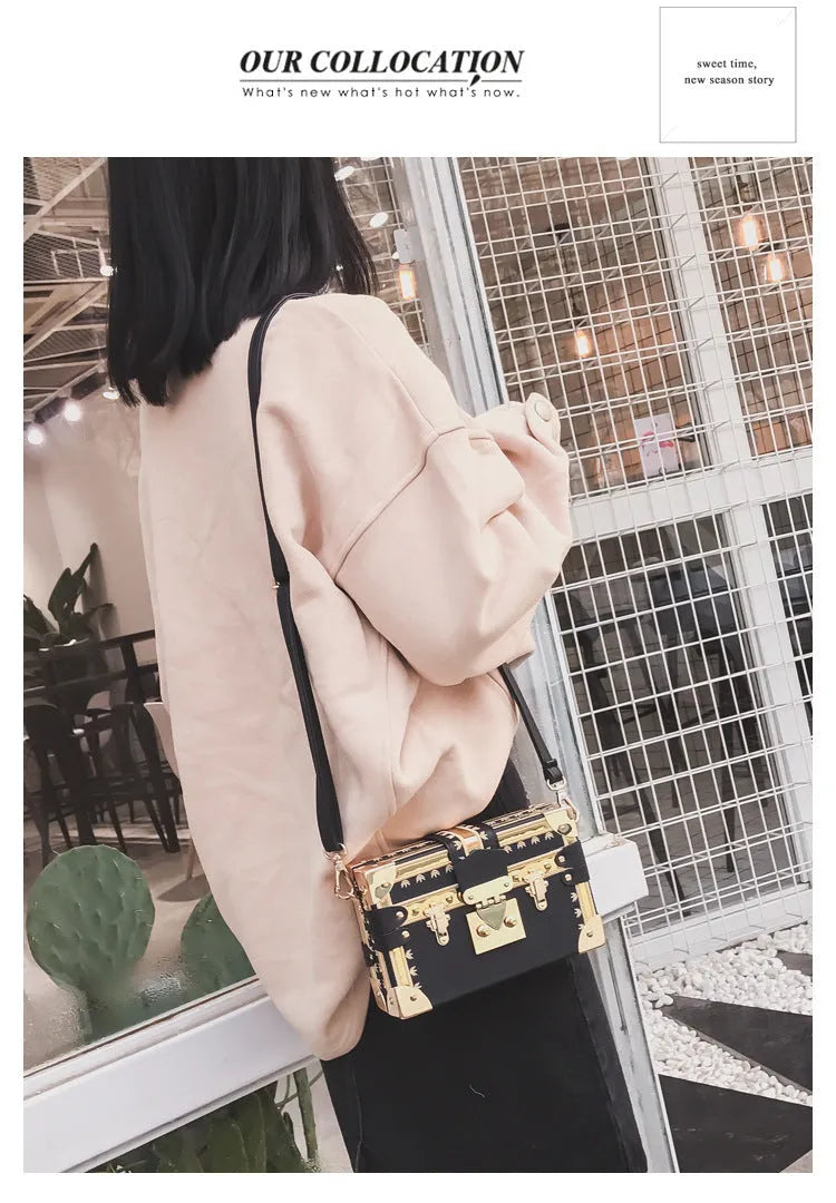 Women's structured black PU shoulder bag with flap and adjustable crossbody strap