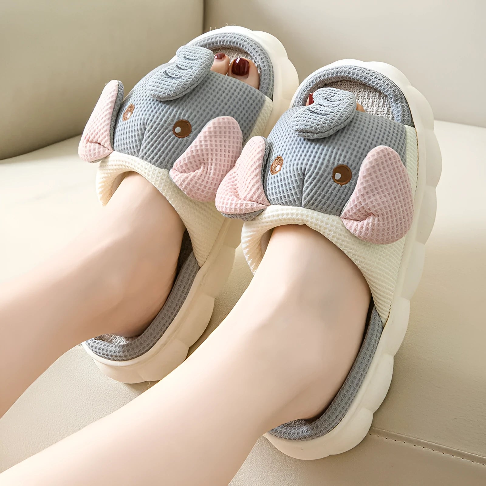 Elephant grey animal print open-toe linen slippers for couples on a PVC sole.