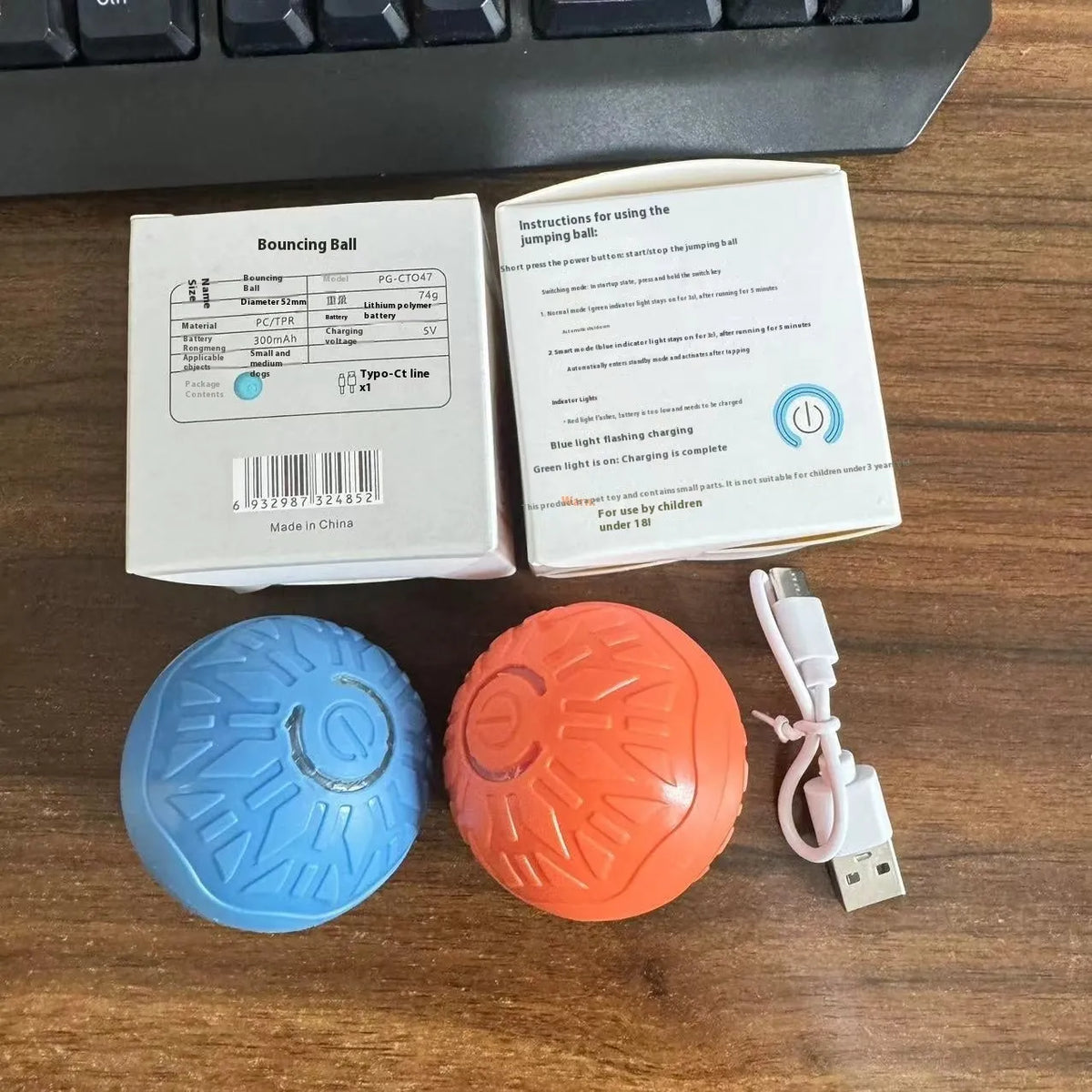 Blue and orange electric jumping ball dog toy with silicone body and thick rubber core