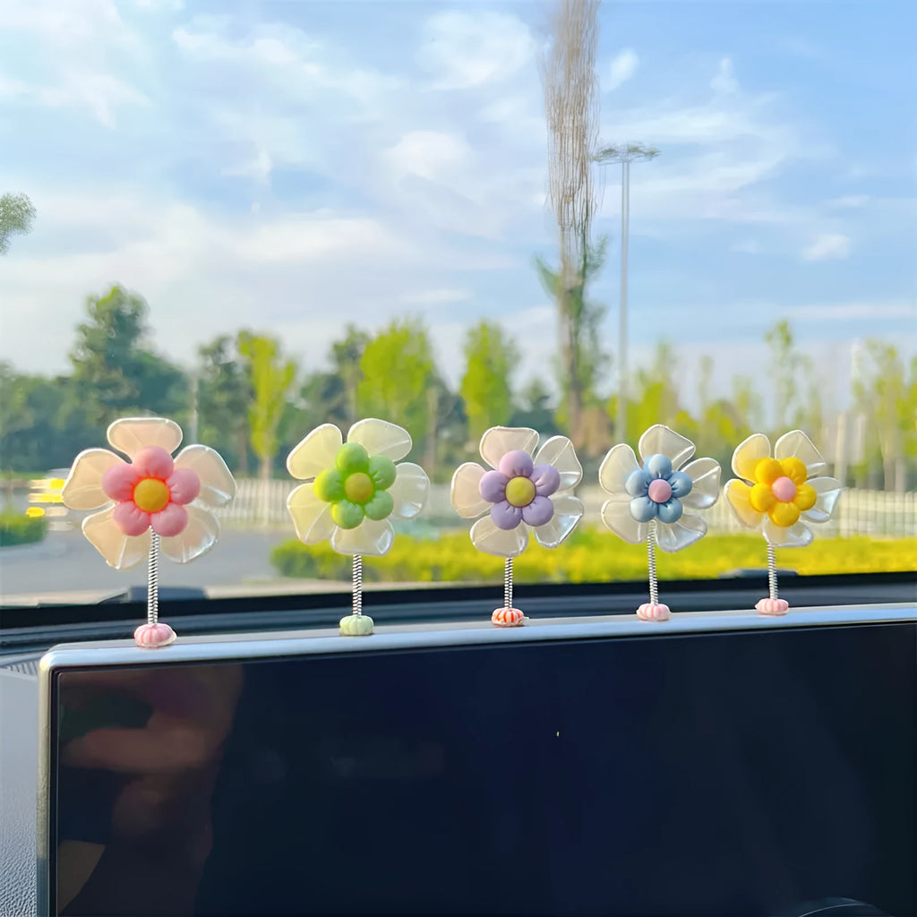 Small blue plastic swing ornament for car dashboard decoration, shown next to a ruler showing 50mm size.