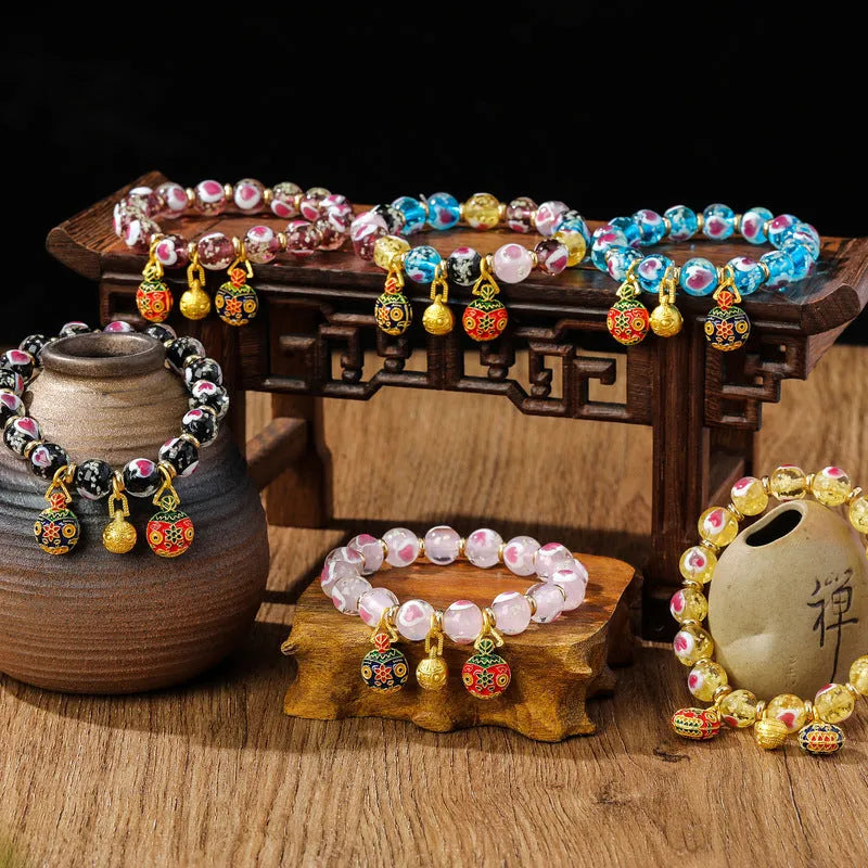 Handmade glass bracelet with swallowing gold beast design and heart shape in various colours