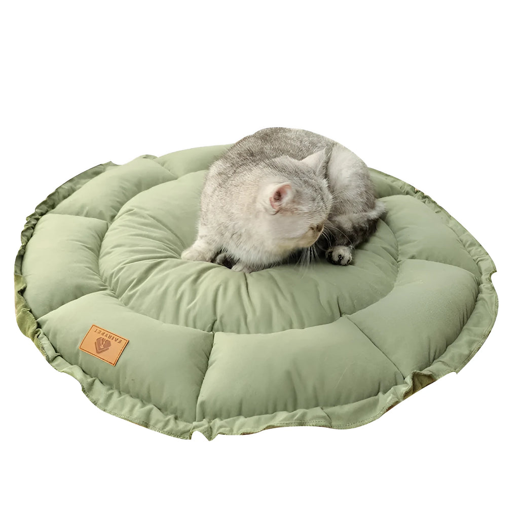 Grey reversible donut-shaped pet bed with a raised rim for a cat or small dog.