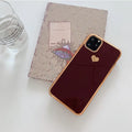 Simple solid-colour TPU back cover case for iPhone on a table, showing blue colour option.