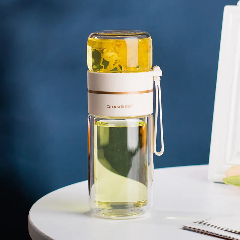 Glass water bottle with tea infuser filter showing double wall construction and portable rope