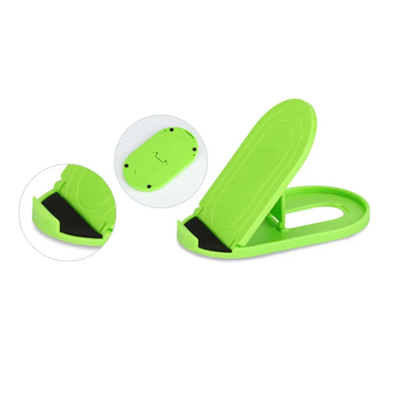 Plastic lazy bracket mobile phone stand in one of six colour options on a desk