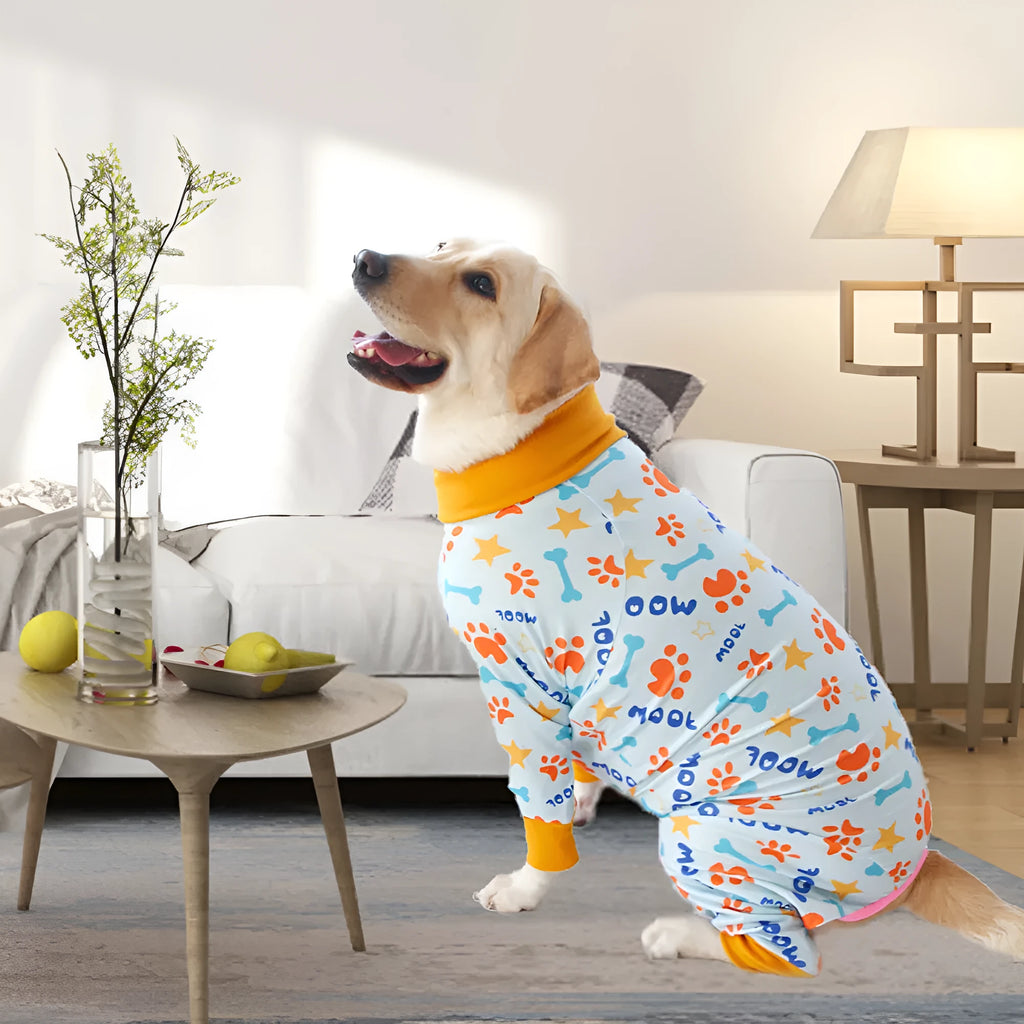 Cotton four-legged dog jumpsuit with colourful print design, shown on a small dog.