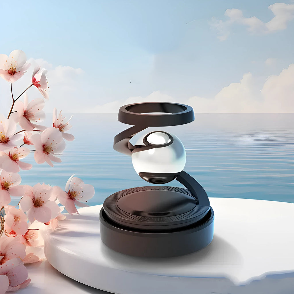 Solar-powered car hanging ornament in Gulong or Ocean colour, 65mm by 81mm.