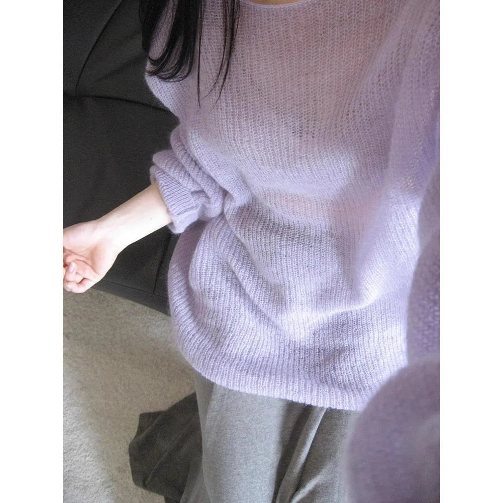Purple women's sleeveless sweater with hollow-out design and shoulder strap detail.