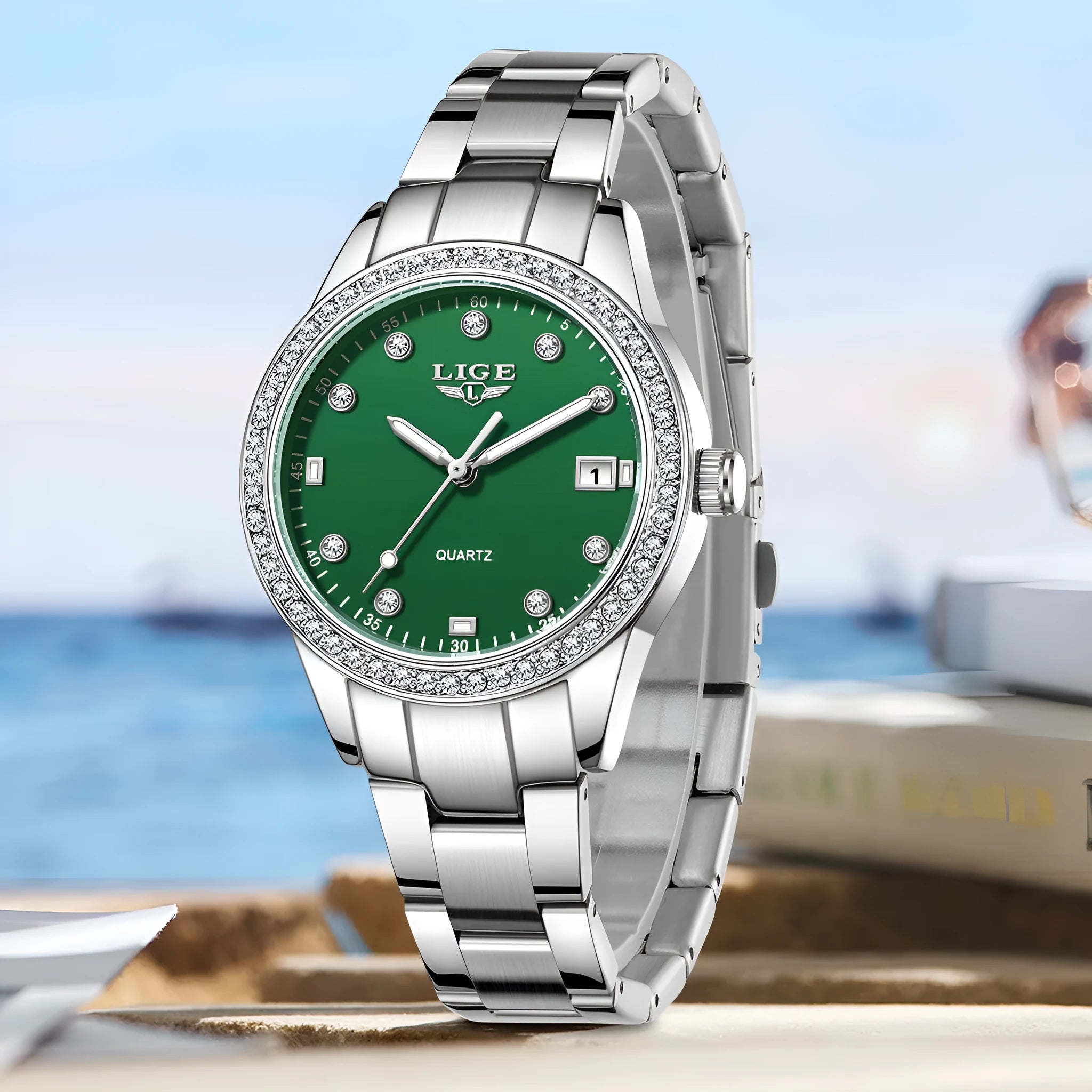 Silver stainless steel fashion watch with diamond-encrusted bezel and luminous dial on a wrist.