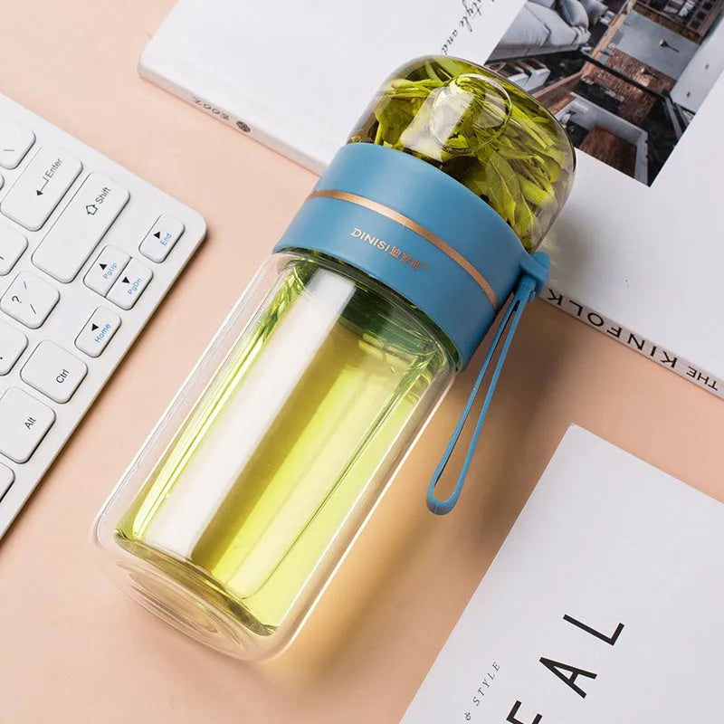 Glass water bottle with tea infuser filter showing double wall construction and portable rope