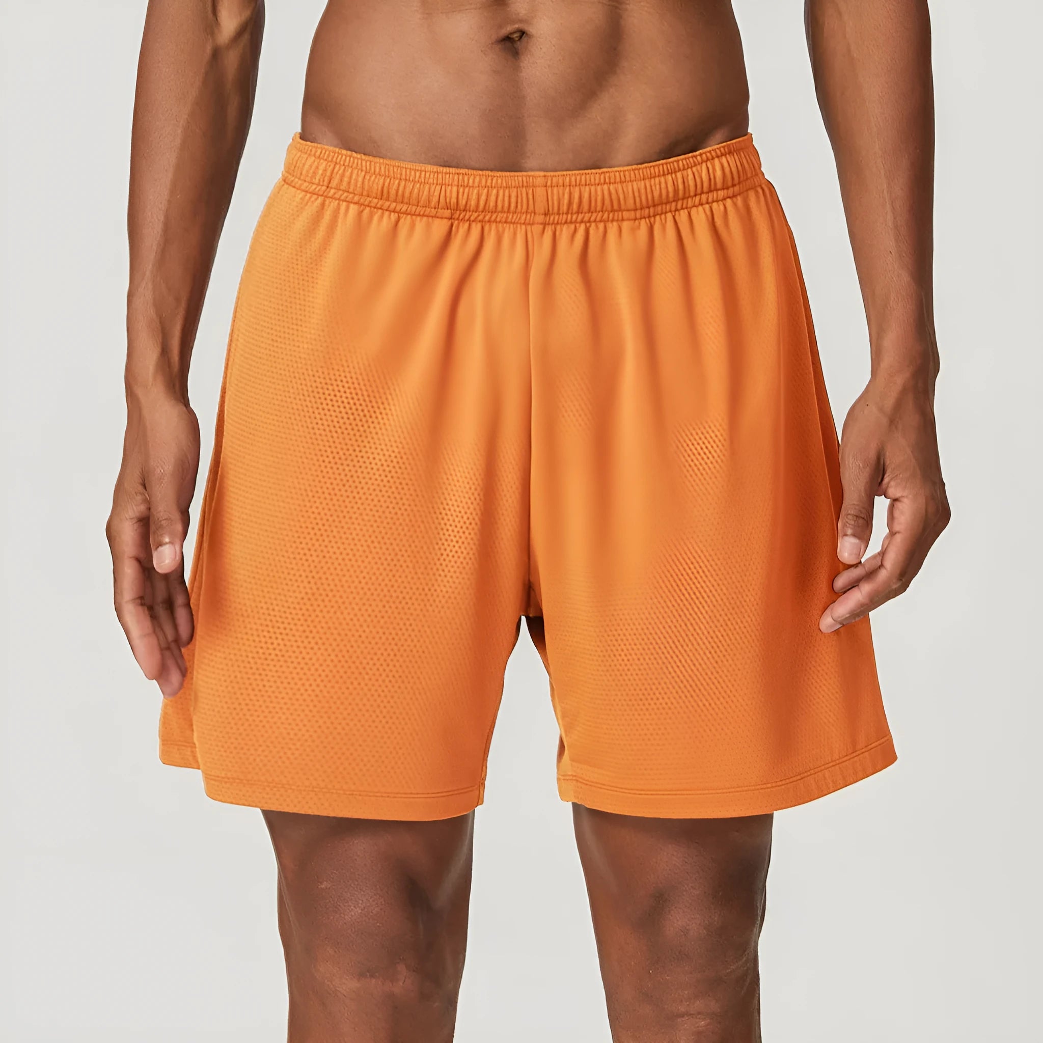 Men's double-layer quick-dry running shorts in brick red colour on a mid-waist fit model.