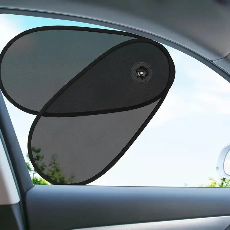 Black breathable mesh car sun shade stretched over a car side window, showing suction cups.