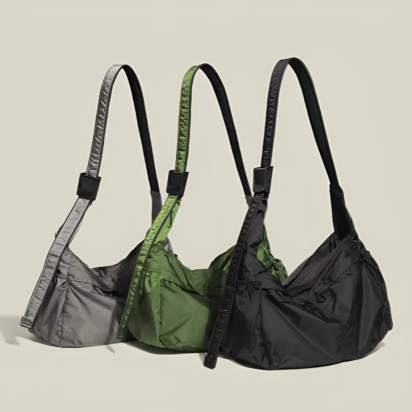 Nylon waterproof messenger bag in black with single shoulder strap and horizontal square design